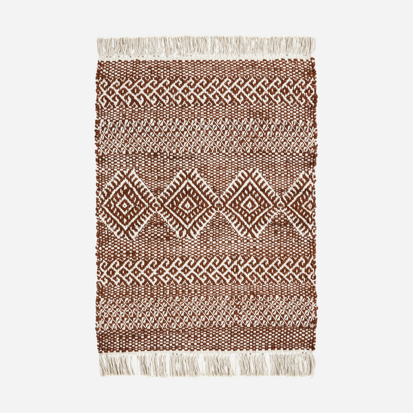 Woven rug with geometric pattern on a white background