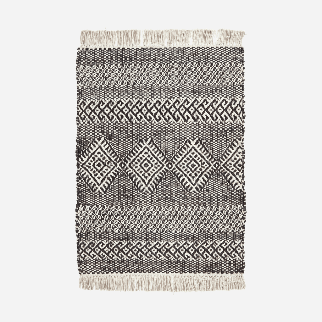 House Doctor Geometric Jute and Cotton Mat - Black - RhoolRugHouse DoctorBlack and white patterned rug with fringes on a light gray background