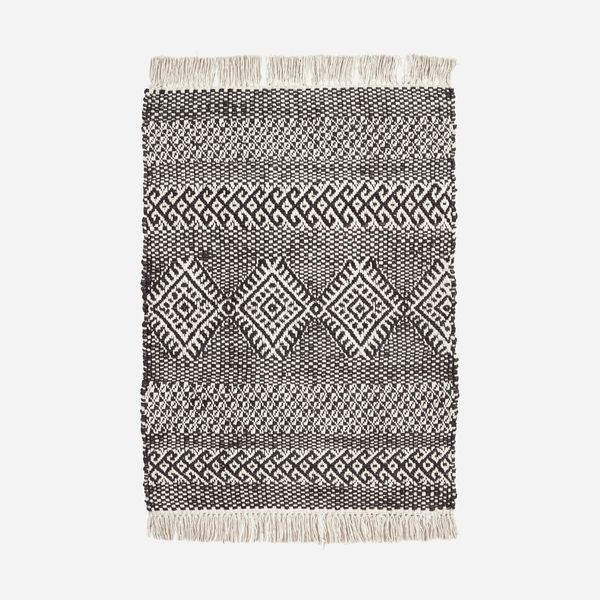House Doctor Geometric Jute and Cotton Mat - Black - RhoolRugHouse DoctorBlack and white patterned rug with fringes on a light gray background